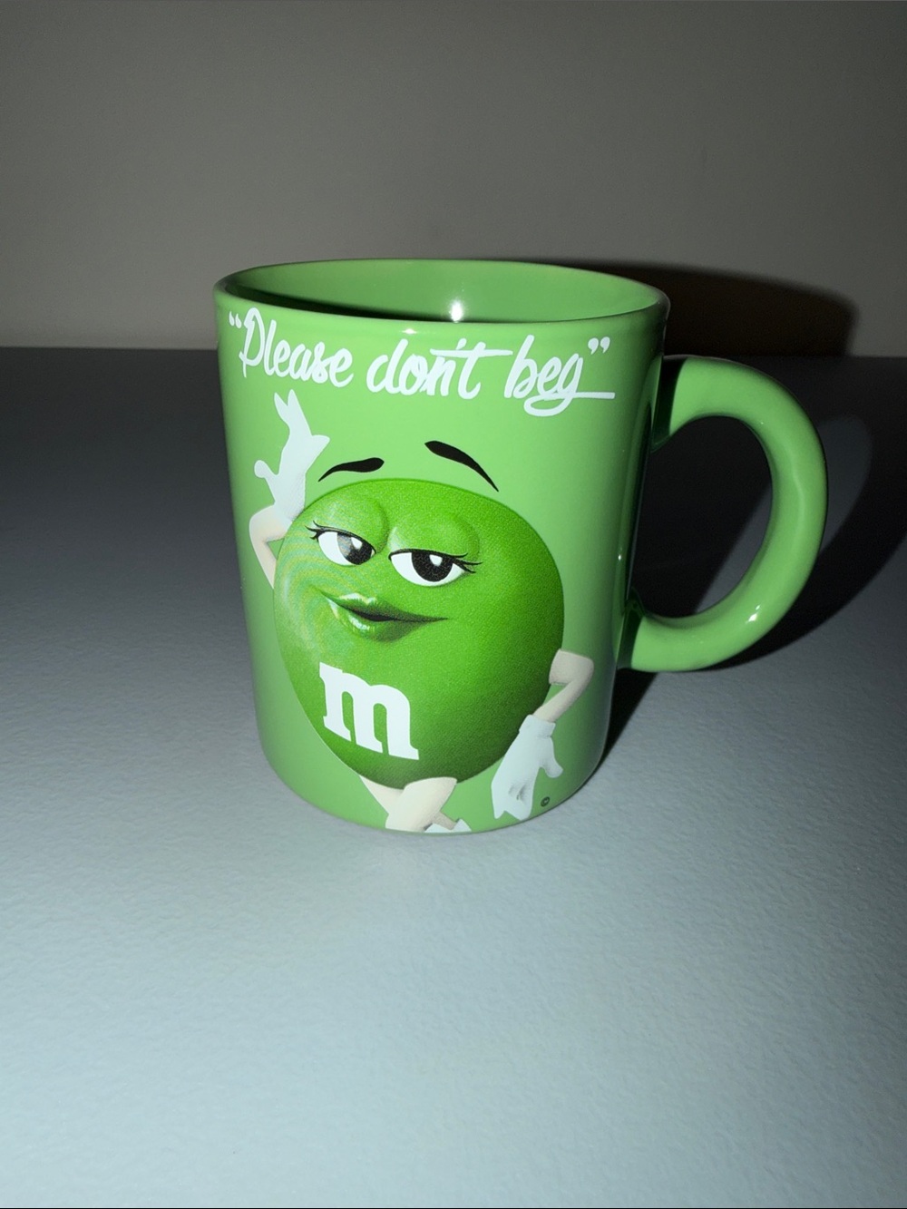 M&M'S Green Character Ceramic Mug with "Please don't beg" Graphic